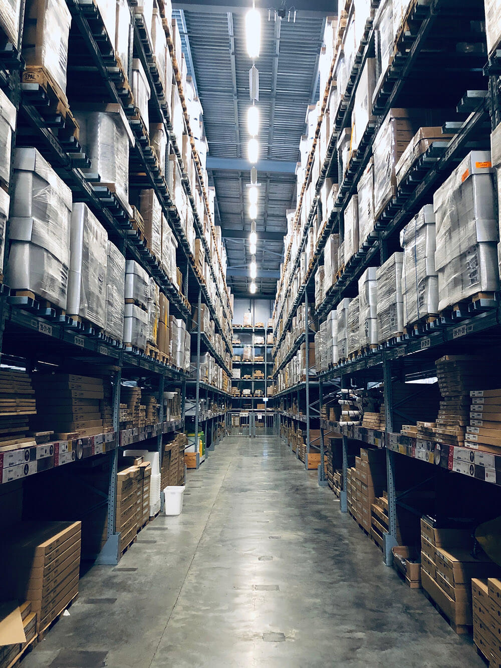 aisle between metal racks in warehouse