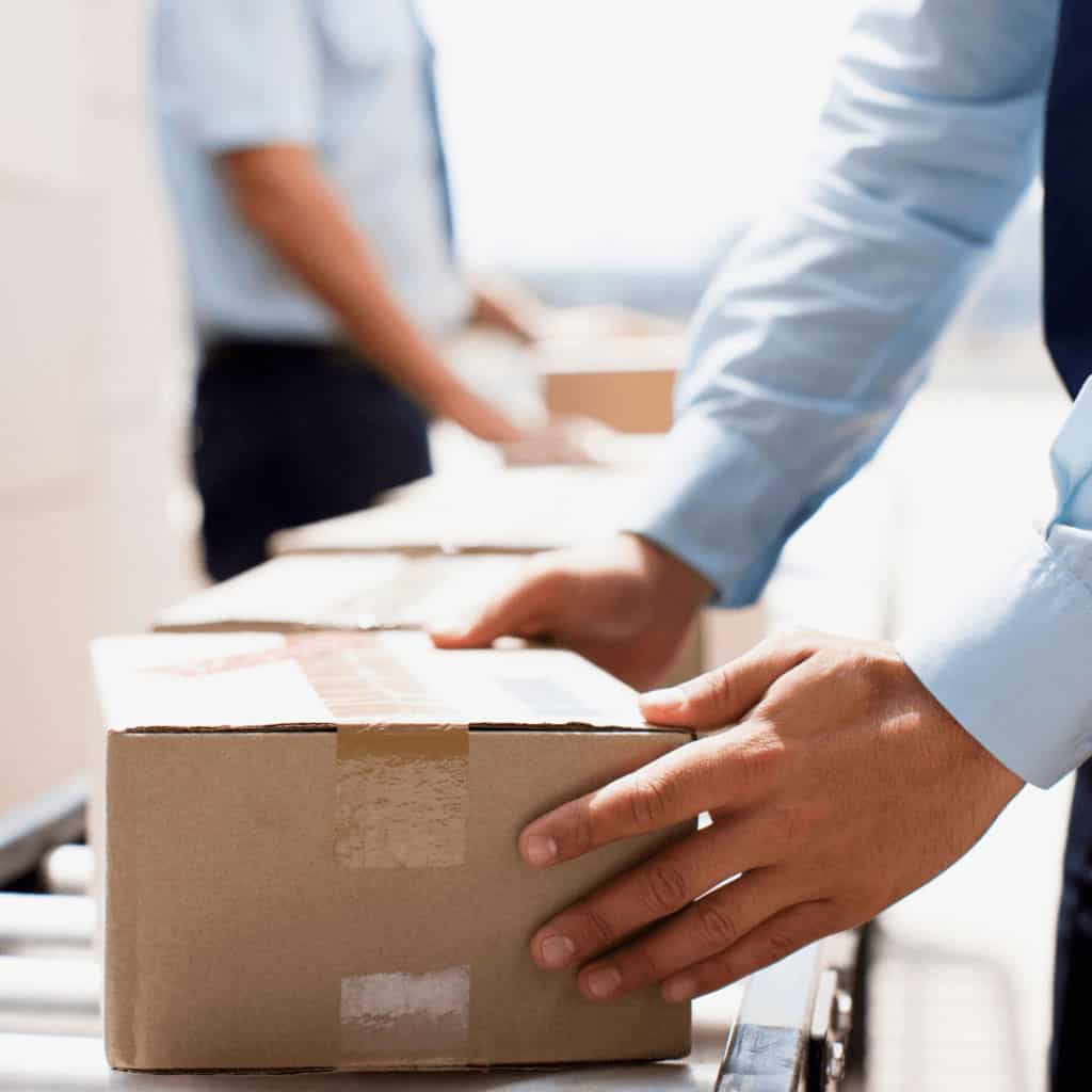 person handling shipping box